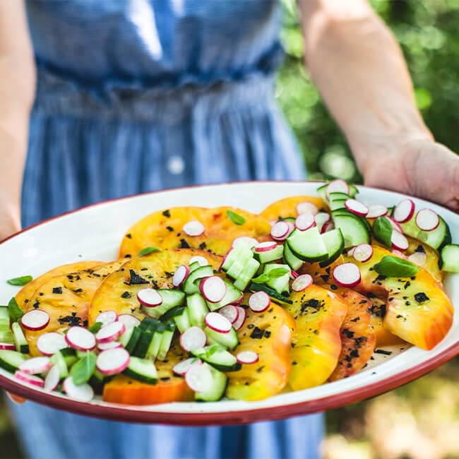 A plate of sliced vegetables