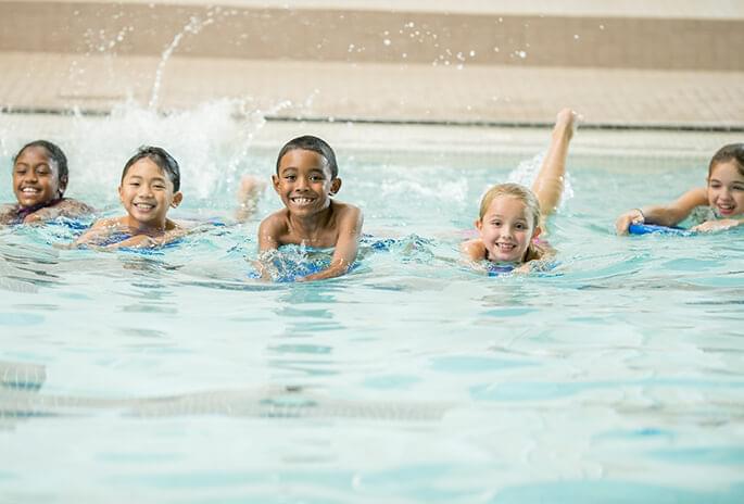 Kids swimming in a pool