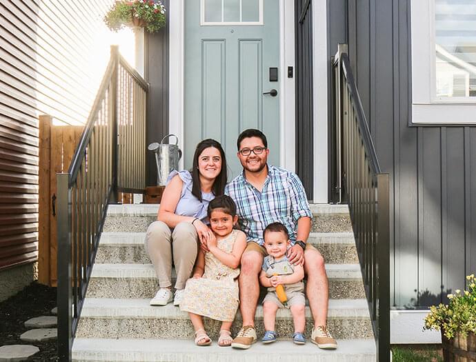 A family sitting on the porch