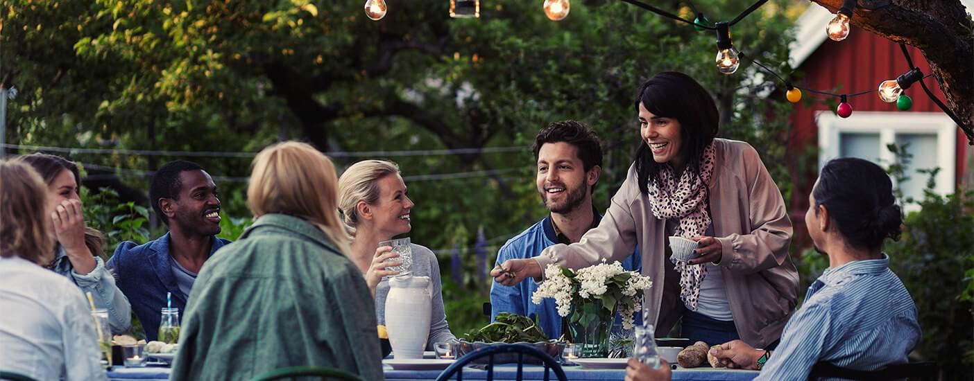 Group of people dining together outside